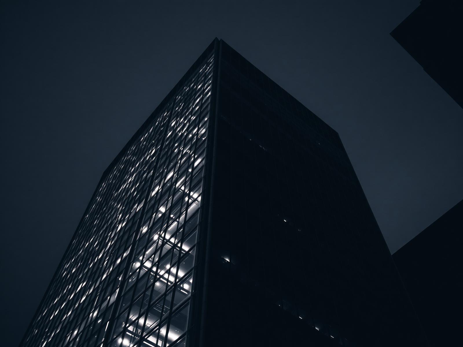Modern commercial tower facade at dusk